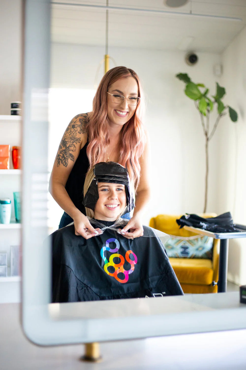 Backwards bib to protect salon chair